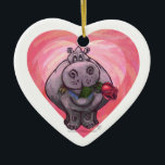 Ornamento De Cerâmica Dia de os namorados Hippopotamus<br><div class="desc">Parada Animal Romântico Hippo Love and Hearts Day Gifts and Accessories criados pelo nosso talentoso artista, Traci Van Wagoner apresenta nossa divertida trabalho de arte de um hipopótamo bonito segurando um rosa bonito na boca. Nosso divertido hipopótamo apaixonado por corações roxas, vermelhas e cor-de-rosa em camadas traz certamente um sorriso...</div>
