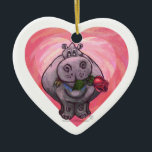 Ornamento De Cerâmica Dia de os namorados Hippopotamus<br><div class="desc">Parada Animal Romântico Hippo Love and Hearts Day Gifts and Accessories criados pelo nosso talentoso artista, Traci Van Wagoner apresenta nossa divertida trabalho de arte de um hipopótamo bonito segurando um rosa bonito na boca. Nosso divertido hipopótamo apaixonado por corações roxas, vermelhas e cor-de-rosa em camadas traz certamente um sorriso...</div>