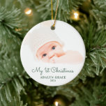 Ornamento De Cerâmica Elegant Script Baby's First Christmas Photo Cerami<br><div class="desc">Este Enfeites de natal redondo oferece o primeiro tema de Natal de um bebê. O texto "Meu Natal de 1rua" aparece num guião verde elegante. O texto personalizado permite adicionar o nome e o ano do seu recém-nascido.</div>