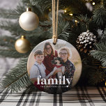Ornamento De Cerâmica Foto e nome da família<br><div class="desc">Lembre-se constantemente da sua prioridade mais importante por perto com este adorável ornamento de manutenção da família. Adicione uma foto favorita a cada lado,  com "família" sobreposta em letras brancas clássicas e seu nome embaixo.</div>