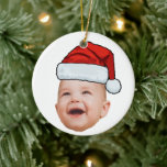 Ornamento De Cerâmica Foto personalizada do rosto do bebê Papai Noel Nat<br><div class="desc">Personalização do rosto do bebê Foto Santa Hat Ornamento Cerâmico de Natal</div>