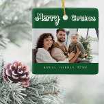 Ornamento De Cerâmica Fotos da família verde de Natal<br><div class="desc">Texto branco: Feliz Natal,  escrito com um roteiro do estilo da moda. Personalize e use sua própria foto e nomes. Um clássico fundo verde.</div>