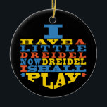 Ornamento De Cerâmica Hanukkah "Dreidel Play"/Ornamento Círculo<br><div class="desc">Chanucá "Eu tenho um pequeno Dreidel... "/Ornamento Círculo. (2 lado) Personalizar apagando o texto na parte traseira do ornamento. Depois, usando a cor, o tamanho e o estilo da fonte favorita, digite suas próprias palavras. O fundo no verso e na frente do ornamento pode ser mudado escolhendo entre as amostras...</div>