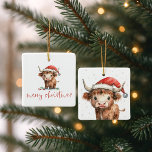 Ornamento De Cerâmica Highland Cow Papais noeis Nome do roteiro Feliz Na<br><div class="desc">Papais noeis de Vaca Highland Nome do roteiro Feliz Natal. Bonitinha festiva para decoração de Natal,  com esta design divertida com uma doce vaca em terras altas no seu chapéu de Papai Noel. Feliz Natal está num roteiro de na moda.</div>