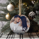 Ornamento De Cerâmica Love Overlay Fotografias e Nomes<br><div class="desc">Crie uma doce lembrança do seu casamento,  lua de mel ou momento especial com este belo ornamento personalizado. Adicione uma foto de casamento favorita a cada lado com "amor" sobreposto em letras brancas clássicas,  e seus nomes embaixo.</div>
