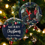 Ornamento De Cerâmica Luzes de Natal galhos de pinheiro neve azul foto<br><div class="desc">Celebre suas memórias de Natal com este encantador ornamento de árvore de Natal. Apresentando uma festiva terra de pinheiro verde com luzes cintilantes, cones de pínus e borbulhas vermelhas e azuis, esta ornamentação permite a personalização com o nome da sua família na frente e uma foto carinhosa no verso. Perfeito...</div>