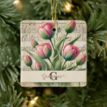 Ornamento De Cerâmica Monograma - Tuliphas Rosa e Verde<br><div class="desc">Comemore a beleza do eterno e o encanto pessoal com o Monograma Pink & Green Vintage Tulips Sheet Music Cerâmica Ornament. Apresentando uma delicada ilustração aquosa de tulipas cor-de-rosa com folhas verdes macios, este elegante design é colocado contra uma camada de fundo de música envelhecida, com notas desbotadas e texturas...</div>