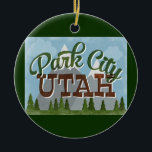Ornamento De Cerâmica Montanhas nevado retros do divertimento de Park<br><div class="desc">O design neo das viagens vintage de Park City Utá no estilo retro dos desenhos animados do divertimento que caracteriza montanhas tampadas neve,  a floresta e as árvores abaixo,  os céus azuis e refrigeram o texto retro do roteiro.</div>