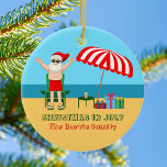Ornamento De Cerâmica Natal em julho Verão Santa Claus Cute Beach<br><div class="desc">Este lindo Natal personalizado em julho faz um presente perfeito para uma festa de verão para uma festa de praia ou reunião de piscinas. Torne-o um polo norte divertido, extravaganza temerária com Papai Noel em seus troncos de natação próximos a um guarda-chuva e presentes de praia listrados e vermelhos. Nunca...</div>