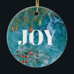 Ornamento De Cerâmica Natal Summer Ocean Beach Joy<br><div class="desc">Cruzando ondas azuis profundas no fundo com coníferas e bagas de Natal moldando a palavra "JOY". Um belo Natal temia design litorâneo ideal para o Natal no Verão ou para as celebrações do Natal litorâneo.</div>