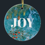 Ornamento De Cerâmica Natal Summer Ocean Beach Joy<br><div class="desc">Cruzando ondas azuis profundas no fundo com coníferas e bagas de Natal moldando a palavra "JOY". Um belo Natal temia design litorâneo ideal para o Natal no Verão ou para as celebrações do Natal litorâneo.</div>