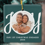 Ornamento De Cerâmica Our 1st Christmas Engaged Photo Green Keepsake<br><div class="desc">This keepsake First Christmas Engaged photo ornament is decorated with the word JOY in stylish script typography on a green background. Easily customizable.</div>