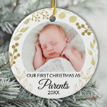Ornamento De Cerâmica Our First Christmas As Parents Photo Gold Foliage<br><div class="desc">This elegant Parents' Christmas Ornament is decorated with gold foliage on a white background.
Easily customizable with baby's photo and year.
Original Watercolor © Michele Davies.</div>