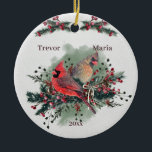 Ornamento De Cerâmica Par de Cardeais 1rua de Natal Juntos<br><div class="desc">Há algo sobre os Cardinais Nortes que evoca o espírito do Natal. Um par deles fará isso ainda mais. E um par unido é a representação perfeita de um casal celebrando juntos o seu primeiro Natal! Eu tirei uma das minhas lindas fotos Cardinais e a transformei em uma aquarela. Então...</div>