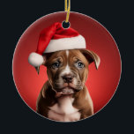 Ornamento De Cerâmica Pit Bull Puppy em Santa Hat<br><div class="desc">Um pit bull (American Staffordshire Terrier) adorável em um chapéu de Papai Noel em um ornamento espantoso.</div>