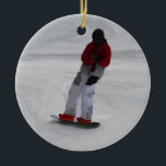 Ornamento De Cerâmica Presente do Esportes de inverno "se preparando par<br><div class="desc">Um legal Snowboarder está a fazer dos ajustes finais antes de atingir as encostas na estância de esqui de Silver Star Mountain. Excelente para crianças e desportistas de todas as idades. Trabalho de arte criado por Val Brackenridge ©.</div>