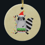 Ornamento De Cerâmica Raccoon Em Santa Hat Entrou Em Luzes De Xmas<br><div class="desc">Um ornamento com um guaxinim fofo vestindo um chapéu vermelho de santa enrolado em algumas luzes coloridas de natal. Preparando-se para decorar sua casa. Colocado sobre um fundo bronzeado.</div>