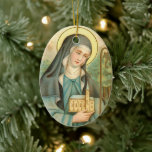 Ornamento De Cerâmica Rua. Brigid da Irlanda (M 014)<br><div class="desc">Você tem várias opções aqui: 1) Deixe o ornamento como está com a mesma imagem do santo em destaque que aparece em ambos os lados. 2) Ocultar ou excluir a imagem do santo em destaque para revelar nosso texto e designs ornamentais padrão. 3) Altere apenas o texto deixando os ornamentos...</div>
