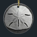 Ornamento De Cerâmica Sand Dollar Seashell Beach Ornament Pental<br><div class="desc">Uma concha de areia dólar repousa na costa da praia de areia com luz lateral suave do pôr do sol. Imagem é uma foto em preto e branco tirada em Playa Grande, Costa Rica na Costa do Pacífico. Personalize este pendente de ornamento da concha marítima com seu próprio texto ou...</div>