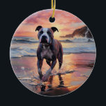 Ornamento De Cerâmica Sandy American Staffordshire Dog em Beach Sunset<br><div class="desc">Mergulhe na beleza tranquila do nosso cão "Sandy Paws and Sunset Hues" na design do pôr do sol da praia. Esta cena cativante captura a essência de uma noite perfeita na costa, com um companheiro leal canino desfrutando das areias ouros e das lutas respiratórias do sol. Quer você seja um...</div>