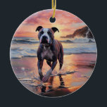 Ornamento De Cerâmica Sandy American Staffordshire Dog em Beach Sunset<br><div class="desc">Mergulhe na beleza tranquila do nosso cão "Sandy Paws and Sunset Hues" na design do pôr do sol da praia. Esta cena cativante captura a essência de uma noite perfeita na costa, com um companheiro leal canino desfrutando das areias ouros e das lutas respiratórias do sol. Quer você seja um...</div>