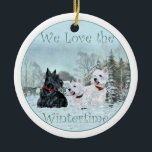 Ornamento De Cerâmica Scottie & Westies Winter Ornament<br><div class="desc">Este Ornamento Scottie e Westies vai parecer excelente na Árvore de Natal! Comprar um para você mesmo ou aquele amigo escocês e Westie amante! Criado do meu trabalho artístico original,  este ornamento é um prazer!</div>