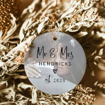 Ornamento De Cerâmica Script Moderno| Sr. e Sra. Wedding Duas Foto<br><div class="desc">Este Enfeites de natal de fotos moderno e moderno apresenta o seu sobrenome e legal, escrito à mão, que diz "Sr. & Sra.", junto com um coração rabiscado. Você pode adicionar duas de suas fotos favoritas de casamento, uma na frente e outra atrás. Um chic e elegante núpcias para os...</div>