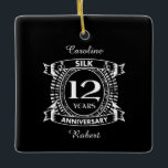 Ornamento De Cerâmica seda do aniversário de casamento da 12<br><div class="desc">Seu décimo segundo aniversário de casamento tem o dom tradicional é a seda. Este design de estilo crest é um design romântico para casais que celebram 12 anos de casamento. Se você quiser alguma ajuda para personalizar este design, por favor, entre em contato comigo, eles podem pedir a este botão...</div>