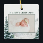 Ornamento De Cerâmica Snowy Woodland Baby é a primeira foto de Natal Cer<br><div class="desc">Feliz Natal! Adicione um sotaque festivo de inverno à sua árvore de Natal com este ornamento personalizado de fotos de bebê de Natal. Apresenta a cor d'água da floresta de inverno de neve. Personalize adicionando fotos, cartões de natal, ano e assinatura da família. Posicione a sua foto favorita de bebê...</div>