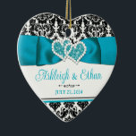 Ornamento De Cerâmica Turquesa, Black Damask Love Heart Casamento<br><div class="desc">Este coração personalizado e romântico em forma de "Nosso Primeiro Natal" tem cor damasco preta e branca em cima e em baixo com fita turquesa e imagem de arco com imagens unidas de corações em cima. Abaixo da fita, as palavras "Nosso Primeiro Natal" são impressas em preto, com o ano...</div>