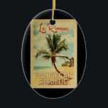 Ornamento De Cerâmica Viagens vintage de Árvore Palm de La Romana<br><div class="desc">Um impressão de arte do século médio moderno La Romana,  República Dominicana,  no estilo viagens vintage. Ele apresenta uma palmeira curva na praia arenosa com oceano sob um céu azul nublado.</div>