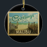 Ornamento De Cerâmica Viagens vintage de praia de Malibu<br><div class="desc">Esta design do cartão postal de Malibu mostra uma praia arenosa com uma bela água turquesa oceânica e acima do mar,  um céu azul com nuvens brancas e onduladas. No estilo viagens vintage.</div>