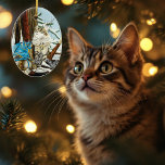 Ornamento De Cerâmica Viking Cat e Blue Dragon<br><div class="desc">Gato da Floresta Norueguesa sentado ao lado de uma árvore com um dragão azul sentado num capacete de garrafa. Neve ao redor deles,  espada e machado viking com eles.</div>