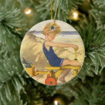 Ornamento De Cerâmica Vintage Boy tocando na praia com Sand Toys<br><div class="desc">Vintage ilustration child image with a linda criança brincando na areia da praia com as ondas do oceano atrás dele. O vento está soprando seu cabelo louro enquanto ele está andando de bicicleta de madeira.</div>
