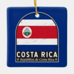 Ornamento De Cerâmica Vintagem Afetada do Sinalizador da Costa Rica<br><div class="desc">Comores afligiram o emblema com a bandeira e o casaco de armas.</div>