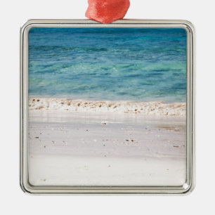 Ornamento De Metal Areia branca semelhante e mar azul-turquesa