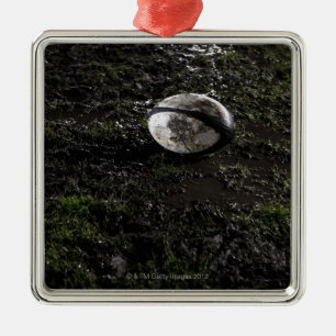 Ornamento De Metal Bola de rugby enlameada que senta-se no mastigado