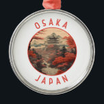 Ornamento De Metal Círculo Retro Distante Osaka Japão<br><div class="desc">Osaka retro vetor viagem design. É conhecida pela sua arquitetura moderna,  vida noturna e comida de rua corajosa. O castelo de Osaka,  que sofreu vários restauros,  do shogunato do século XVI,  é o seu principal marco histórico.</div>