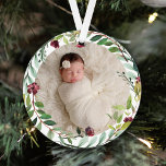 Ornamento First Christmas Green Holiday Wreath Baby Photo<br><div class="desc">This elegant two-sided holiday photo keepsake ornament features a newborn photo of your baby girl framed by a floral watercolor holiday greenery wreath. The back of the ornament includes "First Christmas" wording with custom text that can be personalized with the baby's full name and the year of their birth. Includes...</div>