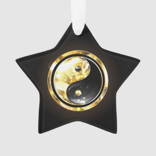 Ornamento Yin Yang dourado em preto