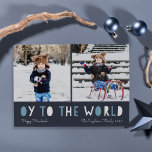 Oy to the World | Cartão com fotos de Hanukkah<br><div class="desc">O cartão com fotos de Chanucá Whimsical apresenta duas das suas fotos favoritas em formato quadrado alinhadas lado a lado. "Oy to the World" aparece abaixo em letras azuis e brancas de recorte. Personalize com seu nome ou nomes de família, saudação personalizada e o ano na parte inferior. Cartões invertem...</div>