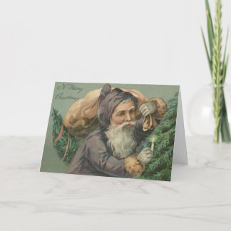 Papai noel com um cartão de Natal do saco