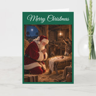 Papai Noel Rezando no Presépio Cartão de Natal