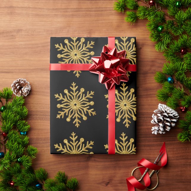 Papel de embrulho preto com floco de neve dourado (Presente de Natal)