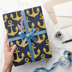 Papel De Presente Âncora do ouro no fundo azul do Marinho