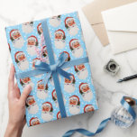 Papel De Presente Blue Vintage Victorian Natal Papai Noel<br><div class="desc">O papel de embrulho de Natal vitoriano Vintage apresenta um fundo azul claro com um tradicional e sorridente Natal Padre vestindo um chapéu vermelho para o padrão da cabeça do Papai Noel. Também incluímos um fundo de neve para uma terra maravilhosa de inverno. Uma elegante e vitoriosa estética de Natal...</div>