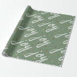 Papel De Presente Livro de Molas de Natal do Green Joy Script<br><div class="desc">Adicione um pouco de elegância aos seus presentes com este papel de embrulho de Natal com guião de Joy verde. O design apresenta um padrão uniforme da palavra "alegria" em uma escrita branca fluente, realçada com flocos de neve de ouro dispersos em um fundo verde de sábio mudo. Perfeito para...</div>