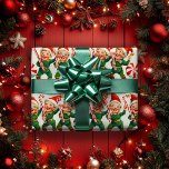 Papel De Presente Retro Holly Jolly Christmas Elves<br><div class="desc">Este padrão apresenta elfos alegres e retrô vestidos de roupas verdes com cintos vermelhos e botas. Todos eles vestem chapéus de Papai Noel com vernizes brancos flufficados e pom de ouro nas pontas. Cada elfo tem uma grande cana doce, e eles estão cercados por elementos festivos, como as matrizes de...</div>