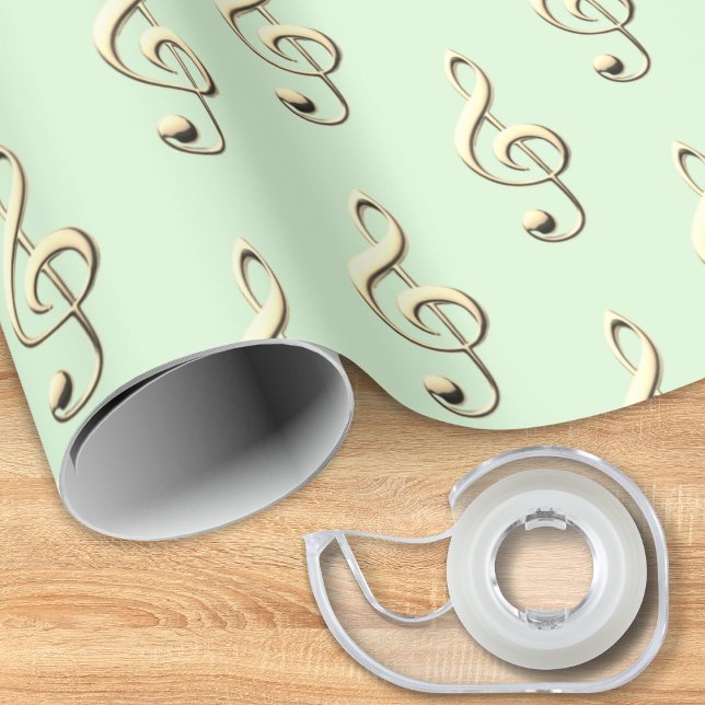 Papel De Presente Símbolo Musical deClave de Sol Amantes da Música V (A music themed roll of gift wrapping paper, in light green with pattern of faux gold treble clefs)