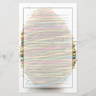 Papelaria Ovos da páscoa coloridos da palha sobre o branco